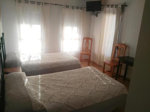 Katil atau katil-katil dalam bilik di Hotel Delphos