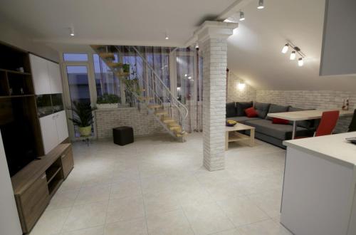 a living room with a couch and a table at Апартаменти Маяк in Odesa