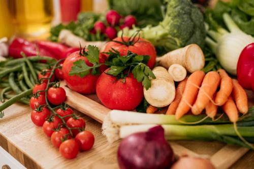 a bunch of fruits and vegetables on a cutting board at Sundial Boutique Hotel in Zagreb