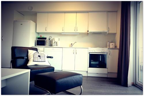 A cozinha ou kitchenette de Flotmyrgården Apartment Hotel