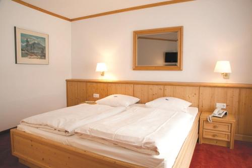 Ein Bett oder Betten in einem Zimmer der Unterkunft Akzent Hotel Deutsche Eiche