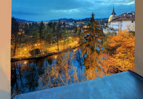 a view of a river from a balcony at Hotel Garni Myší Díra in Český Krumlov