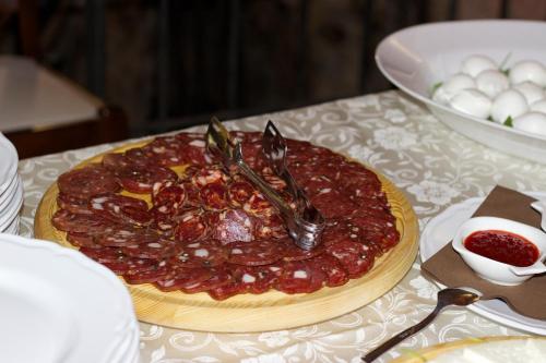 a pizza sitting on top of a table at Villa Cosilinum in Padula