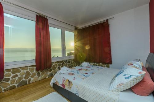 Posteľ alebo postele v izbe v ubytovaní Apartments Bluesun