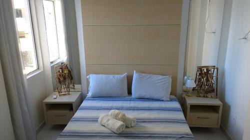 Кровать или кровати в номере Apart Cote D'Azur Maceió