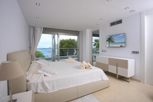 Giường trong phòng chung tại Villamargreenwich
