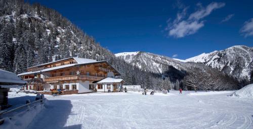 a building on a ski slope in the mountains at Alpengasthof Gern Alm in Pertisau