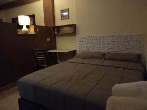 Ένα ή περισσότερα κρεβάτια σε δωμάτιο στο Little Guest House Hotel