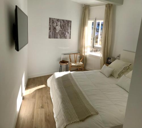 En eller flere senger på et rom på Apartamento de lujo en Sierra Nevada