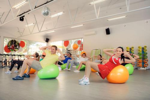 a group of people sitting on balls in a gym at Hotel Garden Istra Plava Laguna in Umag
