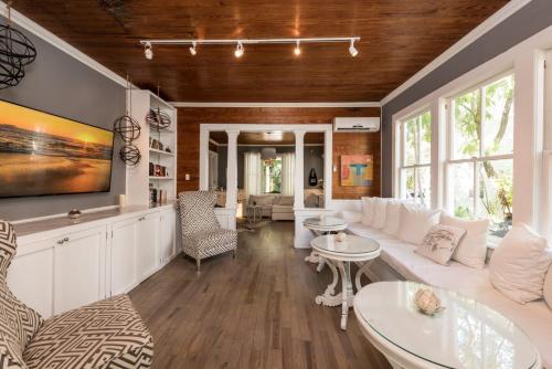 a living room with a couch and a table at Alexander's Guesthouse-Adult Exclusive, LGBTQ Friendly in Key West