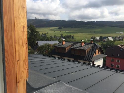 a view of the roofs of houses on a roof at Apartmány Dolní Morava in Dolní Morava