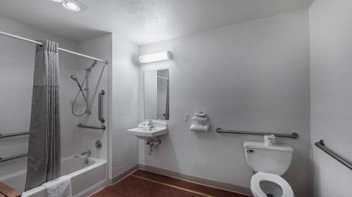 a bathroom with a toilet and a sink and a shower at Motel 6-Medford, OR - North in Medford