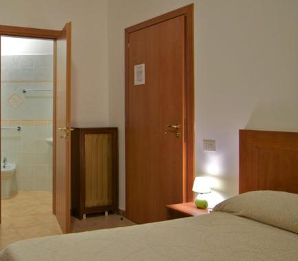 Säng eller sängar i ett rum på Le Stanze Di Nico