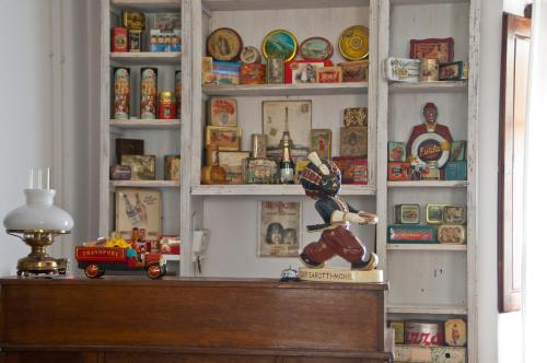 a toy figurine sitting on top of a shelf at Le Terrazze Del Chianti b&b Residenza d'Epoca e di Charme in Tavarnelle in Val di Pesa