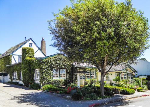 a house with a tree in front of it at Briarwood Inn in Carmel