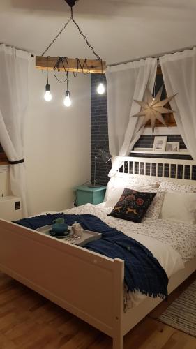 מיטה או מיטות בחדר ב-Apartament PREMIUM Inga
