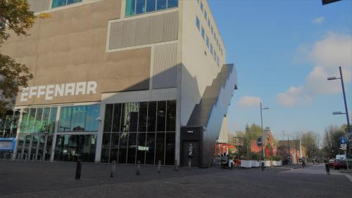 a building with a sign on the side of it at Boutiquehotel Sycamore - Protected City View - 950m from Central Station in Eindhoven