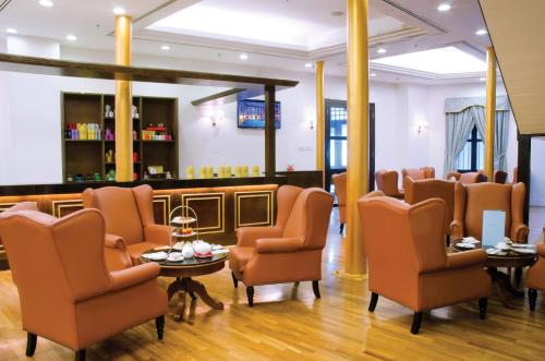 a salon with chairs and a waiting room at Royale Chulan Penang in George Town