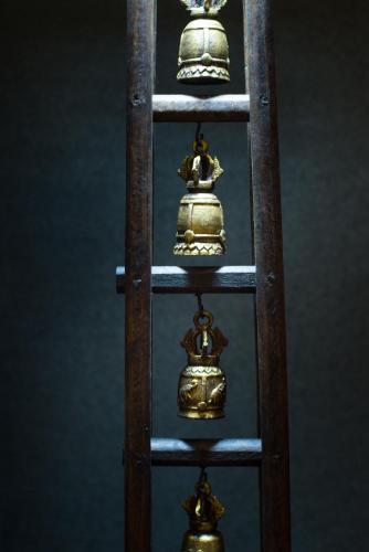 a group of bells on a wooden ladder at Soravit on Granville in Hong Kong