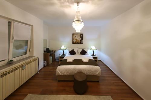 Postel nebo postele na pokoji v ubytování Apartmani "Mimoza"