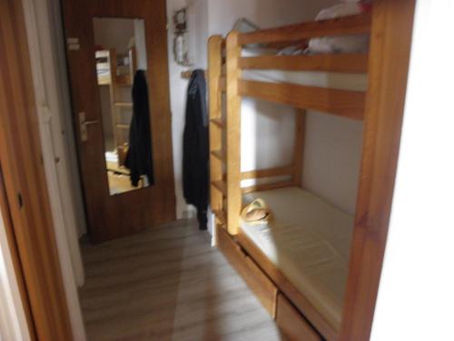 a room with a bunk bed and a hallway at La Dauphinoise Alpe d'Huez in L'Alpe-d'Huez