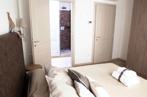 a bedroom with a bed with two pillows on it at B&B Al Pozzo di Luce in Venice