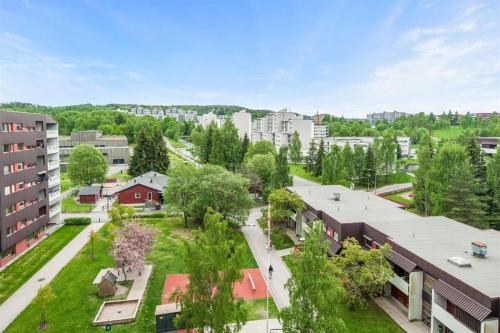 an aerial view of a campus with buildings and trees at Private Room Gransdalen in Oslo