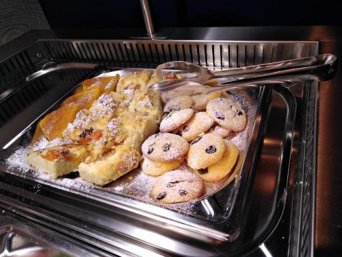 a tray filled with cookies in an oven at Buly Aréna in Kravaře