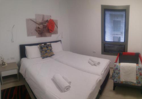 Voodi või voodid majutusasutuse Naama New Boutique Apartment toas