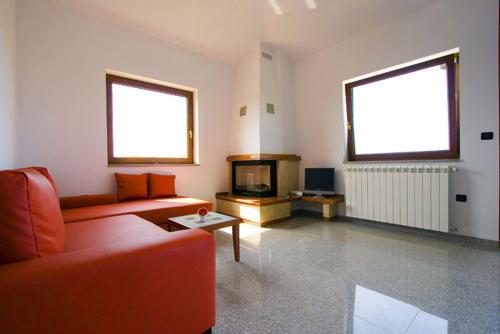 a living room with a couch and a fireplace at Apartments Ana Wellness L in Rovinj