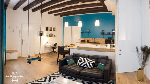 Ένα ή περισσότερα κρεβάτια σε δωμάτιο στο La balançoire