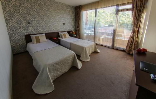 Postel nebo postele na pokoji v ubytování Hotel Spa Terma