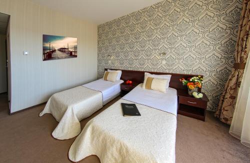 Кровать или кровати в номере Hotel Spa Terma