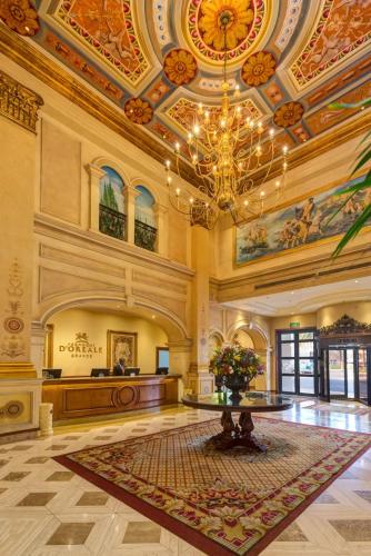 a large lobby with a chandelier and a courtroom at Peermont D'oreale Grande at Emperors Palace in Kempton Park