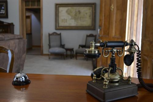 an old fashioned phone sitting on top of a table at Hobbit Boutique Hotel in Bloemfontein