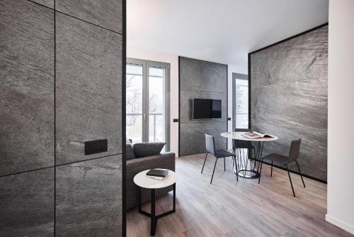 a living room with a couch and a table at La Perla by Sedar in Como