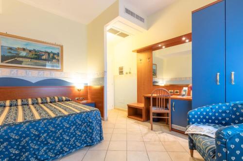 Postel nebo postele na pokoji v ubytování Hotel Borgo Del Mare
