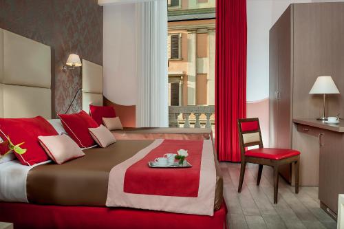 A bed or beds in a room at Demetra Hotel