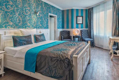 En eller flere senger på et rom på Hotel Prinz Anton
