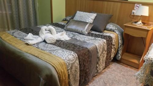 Ένα ή περισσότερα κρεβάτια σε δωμάτιο στο Hostal Ponte Dos Santos