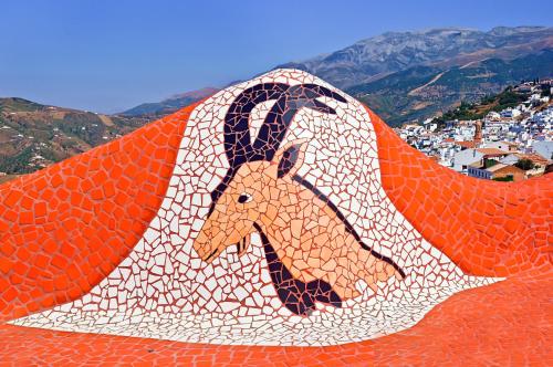 a picture of a horse painted on a roof at Salamandra Plaza in Cómpeta