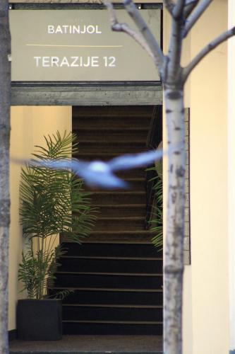 a blue bird flying in front of a building at Dominic Smart & Luxury Suites - Terazije in Belgrade