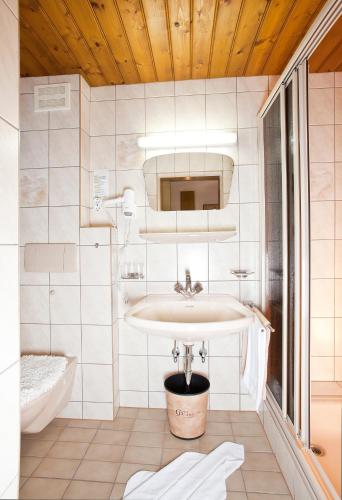 a bathroom with a sink and a toilet in it at Gästeheim Prantl in Sölden