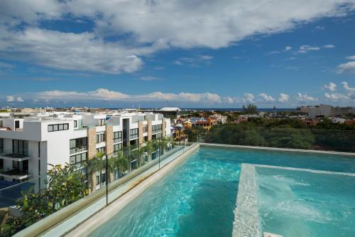 an image of a swimming pool on top of a building at Anah Suites in Playa del Carmen