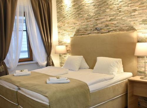 Postel nebo postele na pokoji v ubytování Hotel Torwirt