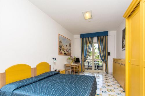 Ένα ή περισσότερα κρεβάτια σε δωμάτιο στο Club Residence La Castellana Mare