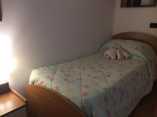 a bedroom with a bed with a purse on it at VillaRosa in Santa Lucia di Piave