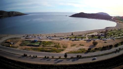 an aerial view of a beach and the water at Surfers' Cottage in Anavissos