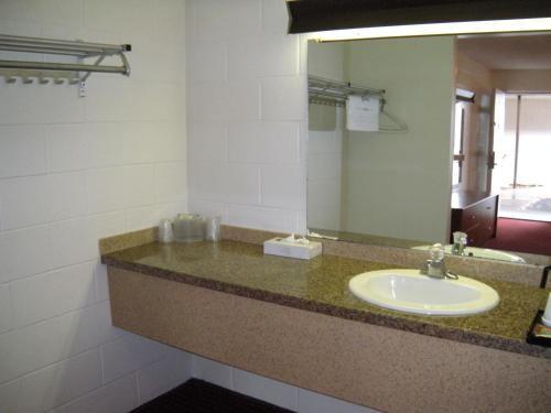 a bathroom with a sink and a mirror at Motel West in Idaho Falls